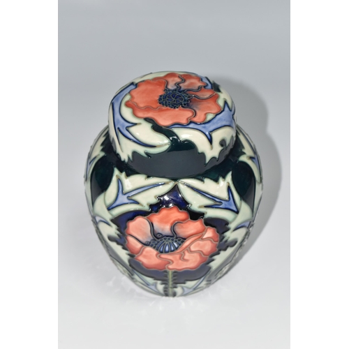 410 - A MOORCROFT POTTERY 'POPPY' PATTERN GINGER JAR AND COVER, tube lined with red poppies on a blue and ... 