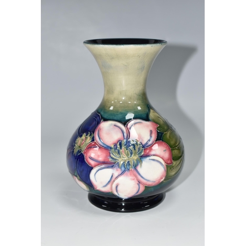 419 - A MOORCROFT POTTERY CLEMATIS VASE, the flared necked vase in 'Clematis' pattern on a graduated green... 