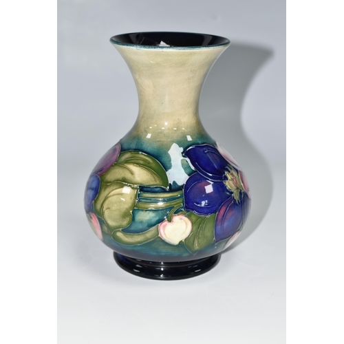 419 - A MOORCROFT POTTERY CLEMATIS VASE, the flared necked vase in 'Clematis' pattern on a graduated green... 