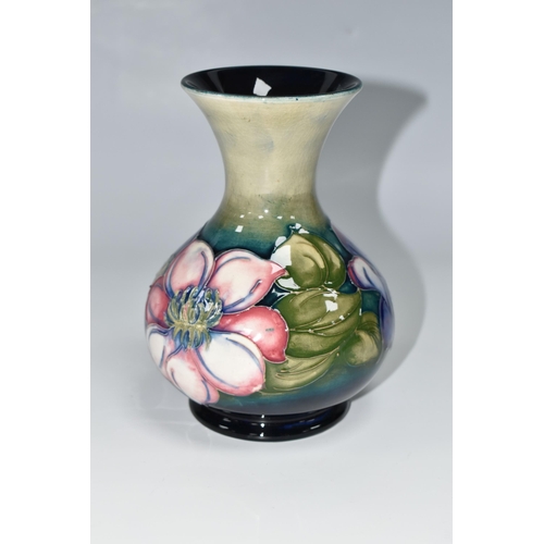 419 - A MOORCROFT POTTERY CLEMATIS VASE, the flared necked vase in 'Clematis' pattern on a graduated green... 