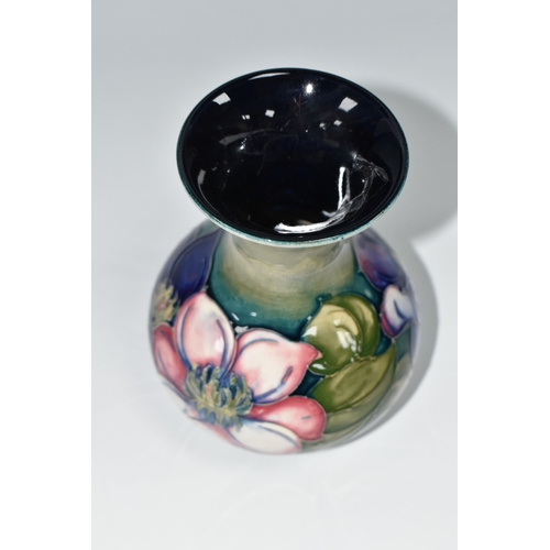 419 - A MOORCROFT POTTERY CLEMATIS VASE, the flared necked vase in 'Clematis' pattern on a graduated green... 