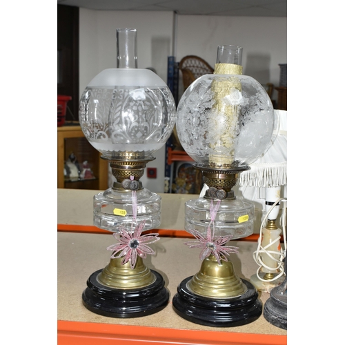 428 - A GROUP OF TABLE LAMPS, comprising two Victorian oil lamps with clear glass reservoirs, a pair of br... 