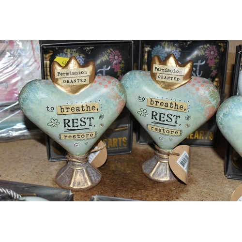 438 - A SELECTION HEART SHAPED ORNAMENTS AND MOTTO WALL PLAQUES, by Kelly Rae Roberts and others, comprisi... 