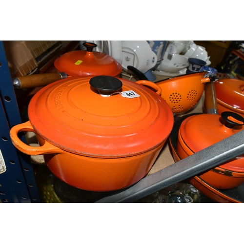 447 - A SMALL GROUP OF ORANGE CAST IRON COOKWARES ETC, comprising a Le Creuset 24cm casserole dish, two un... 