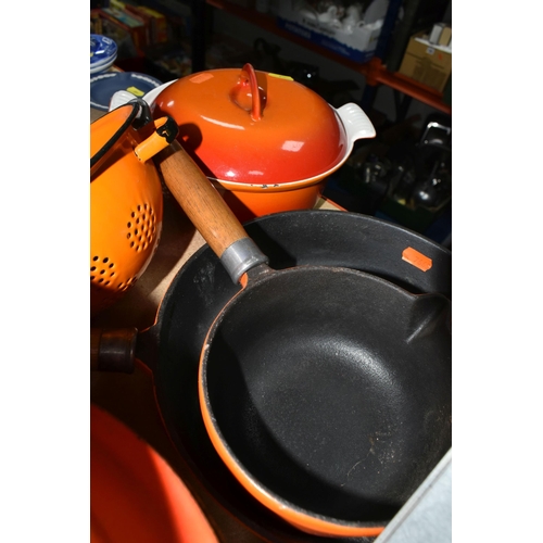 447 - A SMALL GROUP OF ORANGE CAST IRON COOKWARES ETC, comprising a Le Creuset 24cm casserole dish, two un... 