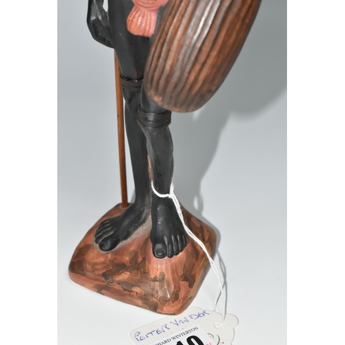 510 - AN AUSTRALIAN MID-CENTURY PIETER VAN DER HELDER ABORIGINAL FIGURE, a slip cast ceramic figure of a m... 