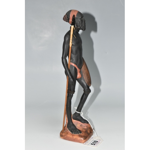 510 - AN AUSTRALIAN MID-CENTURY PIETER VAN DER HELDER ABORIGINAL FIGURE, a slip cast ceramic figure of a m... 