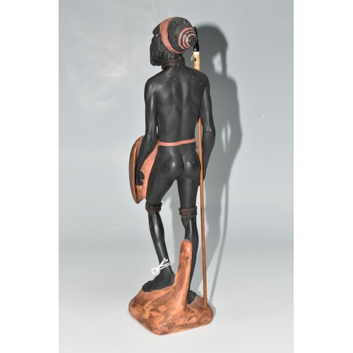 510 - AN AUSTRALIAN MID-CENTURY PIETER VAN DER HELDER ABORIGINAL FIGURE, a slip cast ceramic figure of a m... 