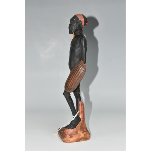 510 - AN AUSTRALIAN MID-CENTURY PIETER VAN DER HELDER ABORIGINAL FIGURE, a slip cast ceramic figure of a m... 