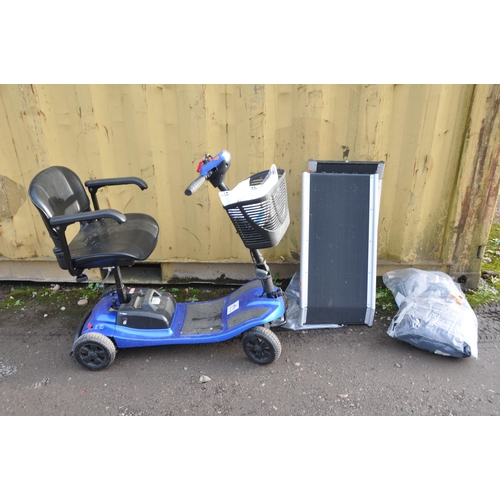 1003 - A LIBERTY MOBILITY SCOOTER with front basket, two keys and charger along with a pair of threshold ra... 