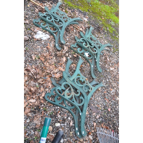 1009 - THREE PAIRS OF MODERN CAST IRON BENCH ENDS with green paint scrolled detail