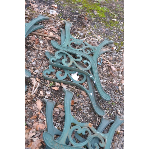 1009 - THREE PAIRS OF MODERN CAST IRON BENCH ENDS with green paint scrolled detail