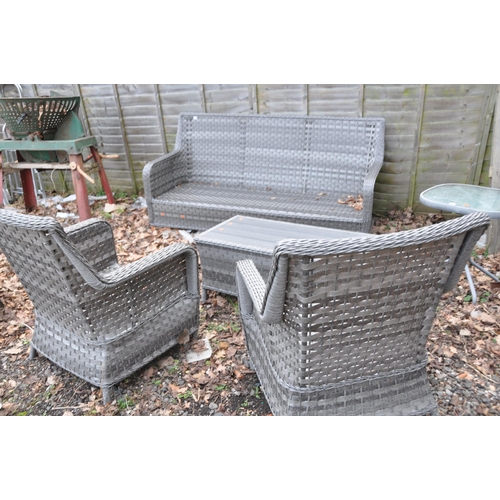 1012 - A MODERN GREY RATTAN EFFECT CONSERVATORY SUITE consisting of a three seat sofa, two chairs and a cof... 