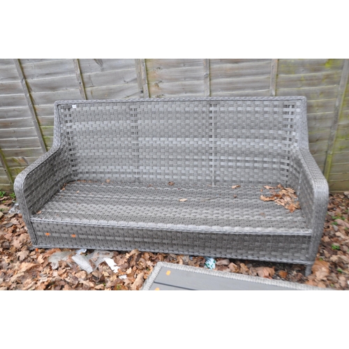 1012 - A MODERN GREY RATTAN EFFECT CONSERVATORY SUITE consisting of a three seat sofa, two chairs and a cof... 