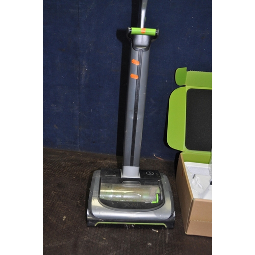 1056 - A G TECH AIR RAM UPRIGHT VACUUM CLEANER and a handheld vacuum with some accessories and one charger ... 