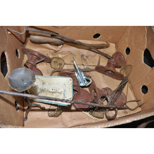 1057 - A TRAY CONTAINING VINTAGE COLLECTABLES including a 28lb weight, a 7lb weight, four irons, an iron on... 