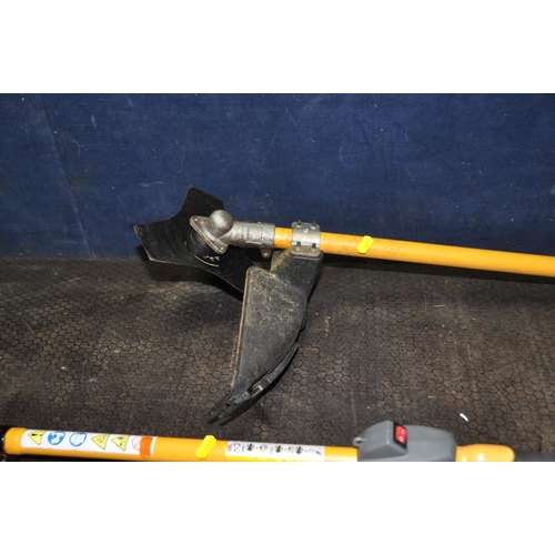 1063 - A RYOBI EXPAND IT PETROL MULTI CUTTER SYSTEM with APR 03 tree lopping chainsaw, a AHF 03 hedge trimm... 