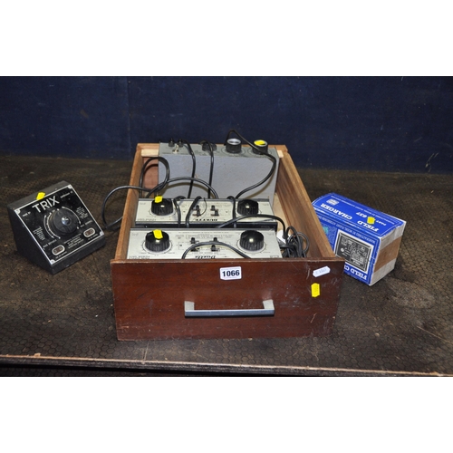 1066 - A DRAWER CONTAINING MODEL RAILWAY AND AIRPLANE POWER SUPPLIES comprising of two H&W Duette, a Trix 4... 