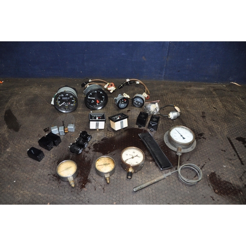 1072 - A TRAY CONTAINING VINTAGE CAR PARTS AND DIALS including rev counter, oedometer, volt and fuel gauges... 