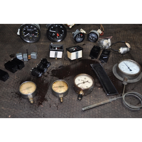 1072 - A TRAY CONTAINING VINTAGE CAR PARTS AND DIALS including rev counter, oedometer, volt and fuel gauges... 