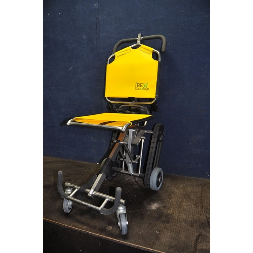 1093 - A IBEX TRAN SEAT MOBILITY CHAIR with folding stainless steel design and flipable seat and back