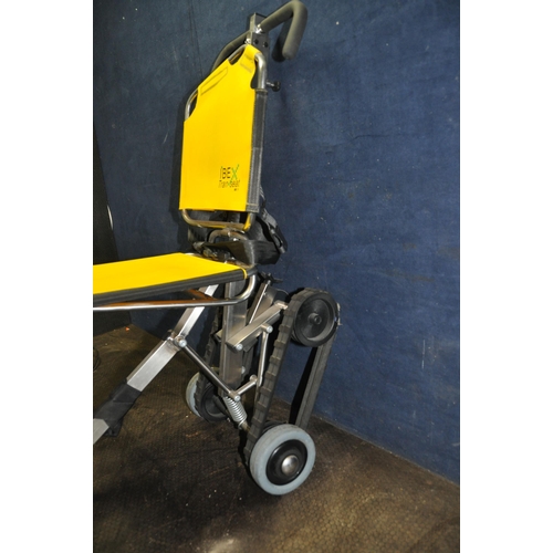 1093 - A IBEX TRAN SEAT MOBILITY CHAIR with folding stainless steel design and flipable seat and back