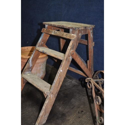 1102 - A SET OF VINTAGE WOODEN STEP STOOL 58cm high a terracotta plant pot, a wrought iron garden wheel bar... 