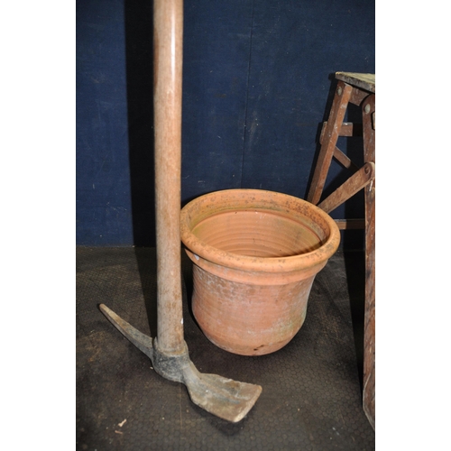 1102 - A SET OF VINTAGE WOODEN STEP STOOL 58cm high a terracotta plant pot, a wrought iron garden wheel bar... 