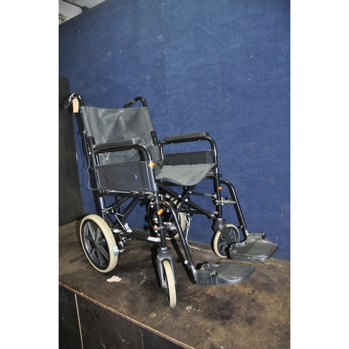 1110 - A REMPLOY FOLDING WHEELCHAIR with two footrests