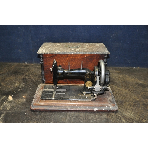 1116 - A VINTAGE PFAFF MANUAL SEWING MACHINE with distressed magogany case