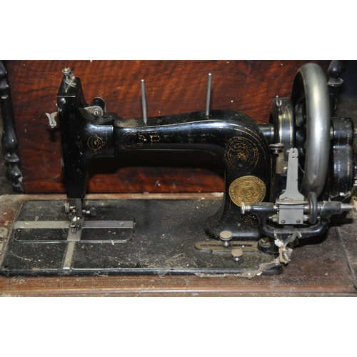 1116 - A VINTAGE PFAFF MANUAL SEWING MACHINE with distressed magogany case