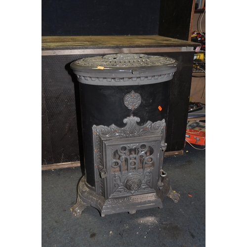 1118 - A GODIN CAST IRON MULTI FUEL STOVE with black and grey enamel finish, oval in shape, height 75cm