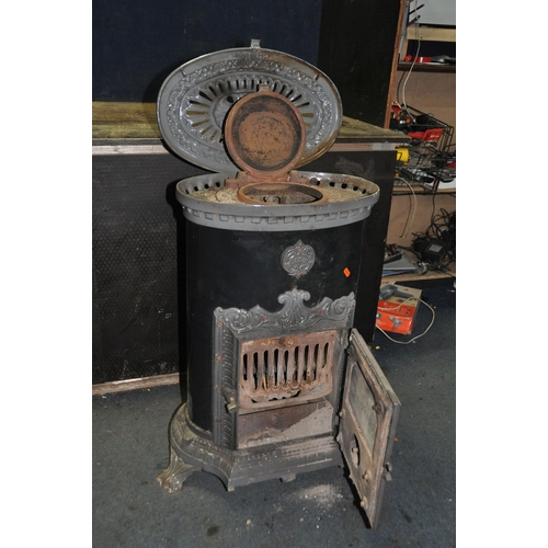 1118 - A GODIN CAST IRON MULTI FUEL STOVE with black and grey enamel finish, oval in shape, height 75cm