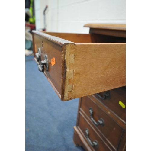 1203 - A 20TH CENTURY YEWWOOD TWIN PEDESTAL DESK, with a green tooled leather writing surface, fitted with ... 