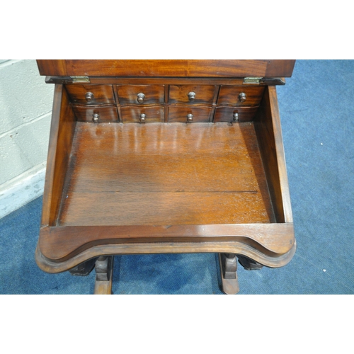 1204 - A REPRODUCTION VICTORIAN STYLE MAHOGANY DAVENPORT, with a small hinged compartment, a large hinged c... 