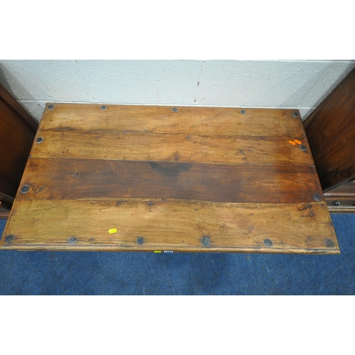 1207 - A HARDWOOD RECTANGULAR COFFEE TABLE, with two drawers, metal studs and supports, length 110cm x dept... 