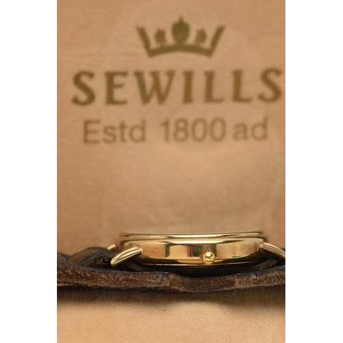 12 - A BOXED GENTS 9CT GOLD 'SEWILLS' WRISTWATCH, quartz movement, round cream dial signed 'Sewills, Estd... 