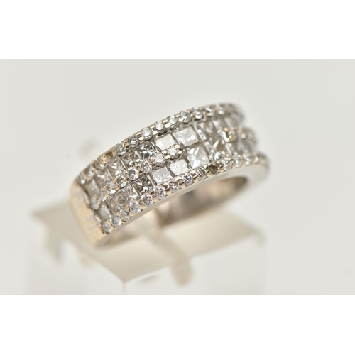 6 - A DIAMOND DRESS RING, designed as two rows of princess cut diamonds, each row flanked by brilliant c... 