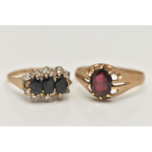 79 - TWO 9CT GOLD RINGS, the first an oval cut garnet, prong set in yellow gold, hallmarked 9ct Birmingha... 