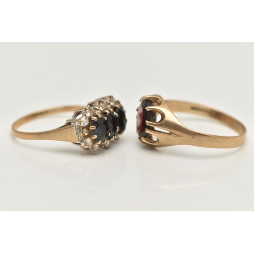 79 - TWO 9CT GOLD RINGS, the first an oval cut garnet, prong set in yellow gold, hallmarked 9ct Birmingha... 