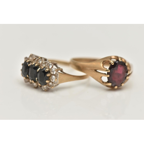 79 - TWO 9CT GOLD RINGS, the first an oval cut garnet, prong set in yellow gold, hallmarked 9ct Birmingha... 