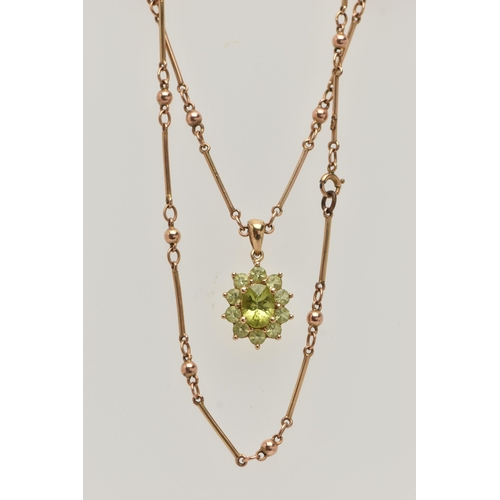 9 - A 9CT GOLD GEM CLUSTER PENDANT WITH CHAIN, the pendant designed as a central oval green gem, surroun... 