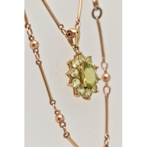 9 - A 9CT GOLD GEM CLUSTER PENDANT WITH CHAIN, the pendant designed as a central oval green gem, surroun... 