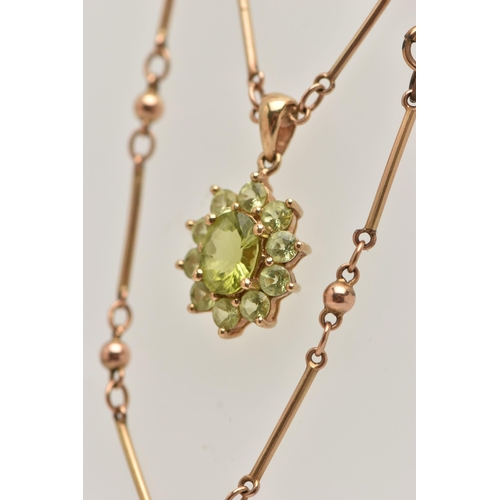 9 - A 9CT GOLD GEM CLUSTER PENDANT WITH CHAIN, the pendant designed as a central oval green gem, surroun... 