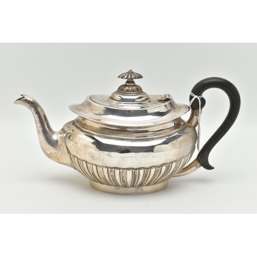 100 - AN EDWARDIAN SILVER TEAPOT, oval form with a polished and stop reeded pattern, engraved crest dated ... 