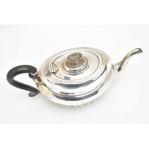 100 - AN EDWARDIAN SILVER TEAPOT, oval form with a polished and stop reeded pattern, engraved crest dated ... 