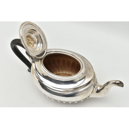 100 - AN EDWARDIAN SILVER TEAPOT, oval form with a polished and stop reeded pattern, engraved crest dated ... 