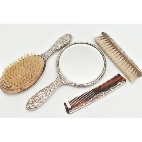 103 - A FOUR PIECE SILVER VANITY TABLE SET, comprising of a hair brush, clothes brush, hand held mirror an... 