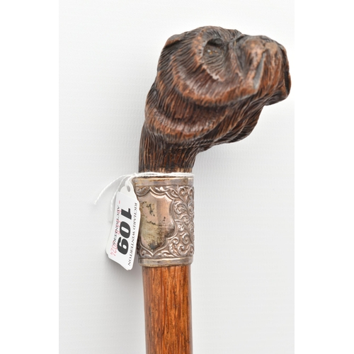 109 - A LATE VICTORIAN NOVELTY WALKING STICK WITH CARVED WOODEN DOG'S HEAD HANDLE, fitted with glass eyes,... 