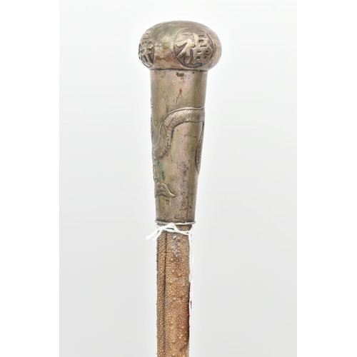 110 - A LATE 19TH CENTURY STINGRAY TAIL WALKING CANE WITH CHINESE WHITE METAL MOUNT, the mount engraved wi... 